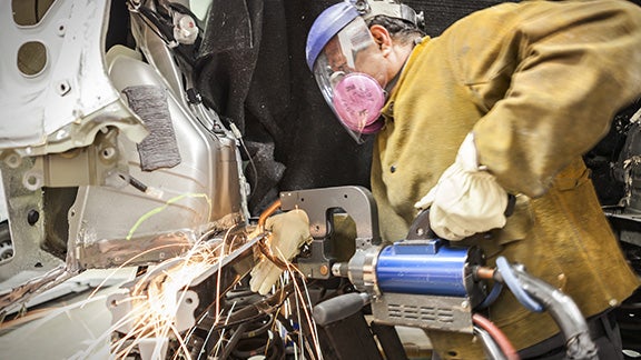 Collision Center Technician Repairing Vehicle | Fremont Toyota Lander in Lander WY