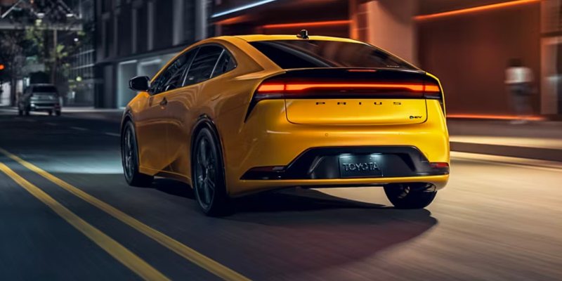 2027 Toyota Prius aerodynamic liftback profile on open highway